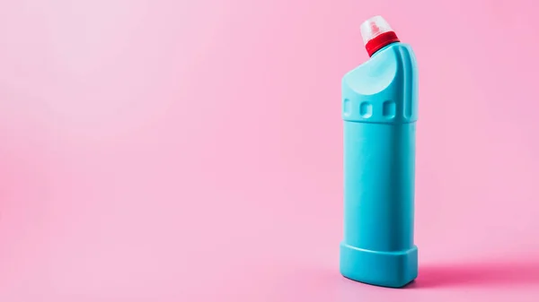 Close up view of cleaning fluid, pink background — Stock Photo