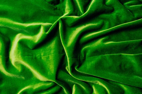 Top view of green shiny velvet textile as background — Stock Photo