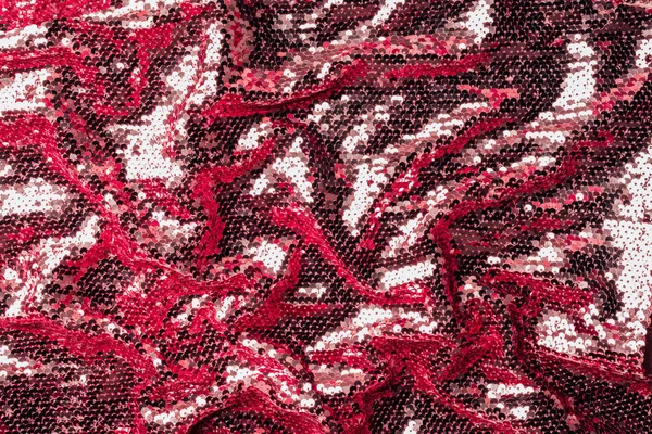 Vue du dessus du textile bordeaux avec des paillettes brillantes comme arrière-plan — Photo de stock