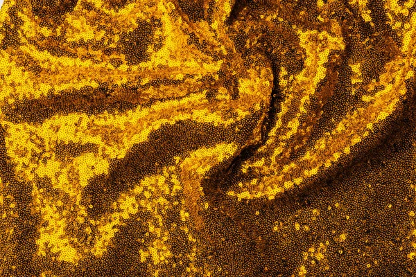 Top view of yellow textile with glossing sequins as background — Stock Photo