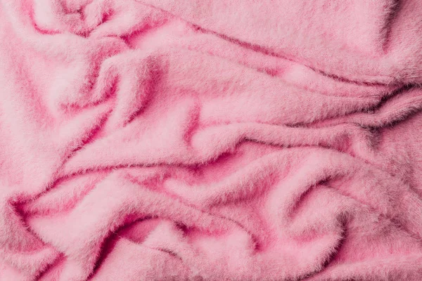 Верхний вид розового махрового мягкого текстиля в качестве фона — стоковое фото
