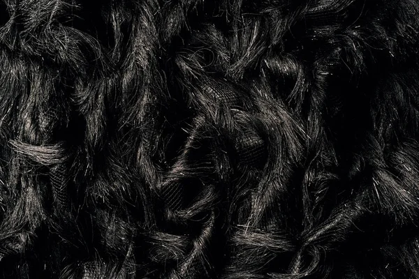 Vue du dessus du textile noir fourrure comme arrière-plan — Photo de stock