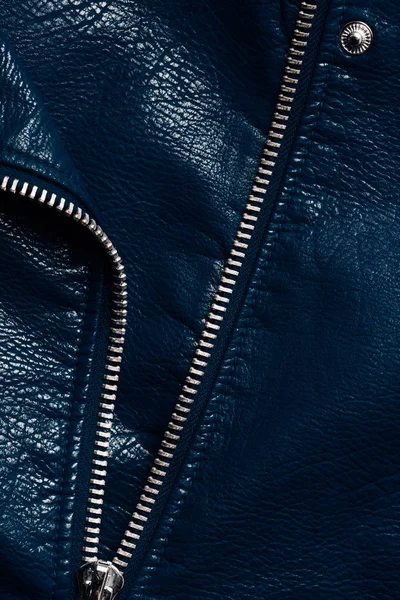 Top view of dark blue leather textile with zipper as background — Stock Photo