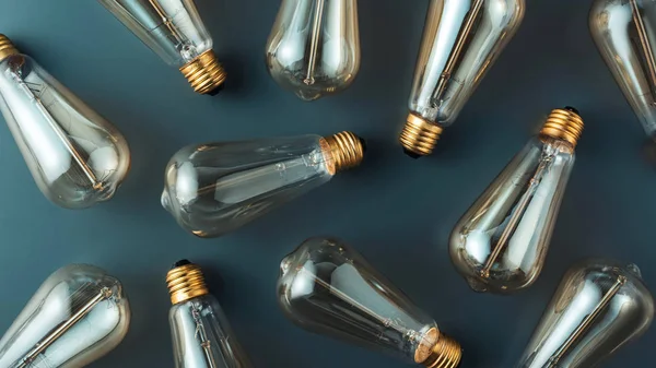Top view of pattern made of light bulbs on grey — Stock Photo
