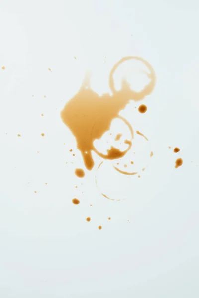 Top view of messy white surface with coffee blots — Stock Photo