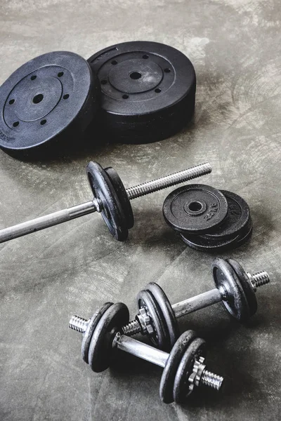 High angle view of gym equipment on concrete surface — Stock Photo