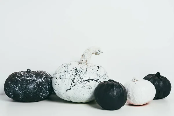 Scary decorative black and white pumpkins with paint splatters for traditional halloween party — Stock Photo