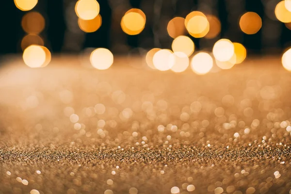 Golden sparkling sequins with bokeh on background, christmas concept — Stock Photo