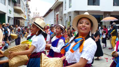 Cuenca, Ecuador-April 11, 2019: Folk dancers represent variety of Ecuadorian culture in traditional dress of cuencano, canari, saraguro, cayambe, otavalo, Tschila and Achuar, afro-ecuadorian group clipart