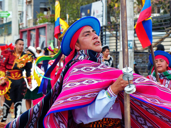 Cuenca, Ecuador-September 21,2019: Celebration of the Killa Raymi or the Andean festival of the moon in Cuenca. Men folk dancers represent culture of the region Sierra (mountains) in traditional dress