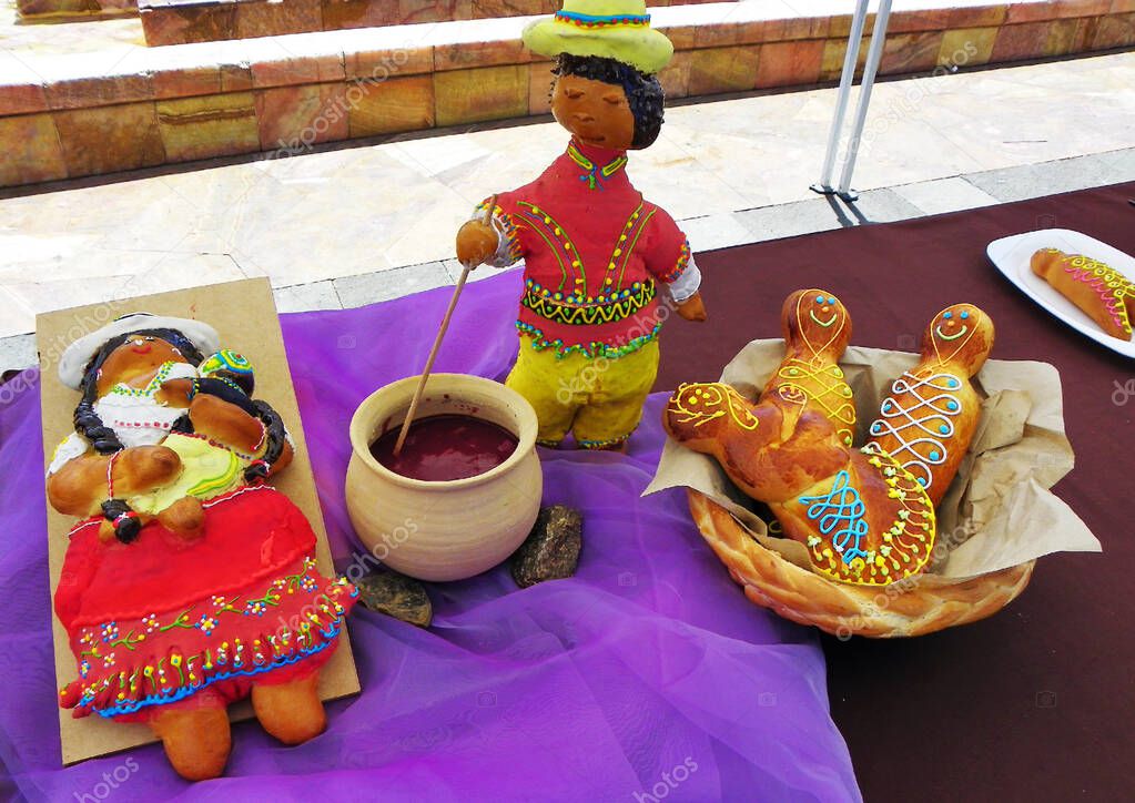 Bread 'Guagua de pan' or Ecuadorian bread figures. Breads made of wheat, molded and decorated in the shape of a small child or baby, tradition for events 'Day of the Dead'. Cuenca, Ecuador