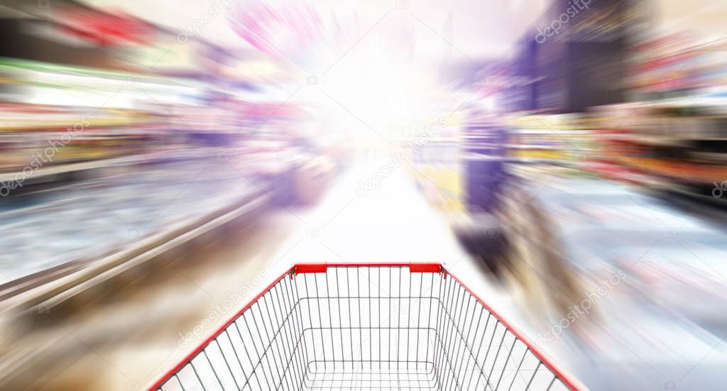 Empty Shopping cart on abstract supermarket background
