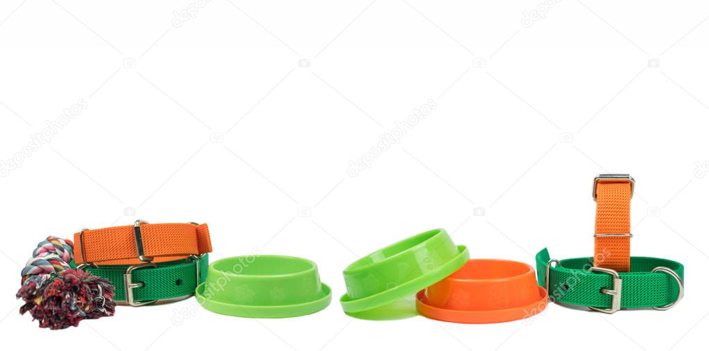 Pet collars and bowls with copy space on isolated white background