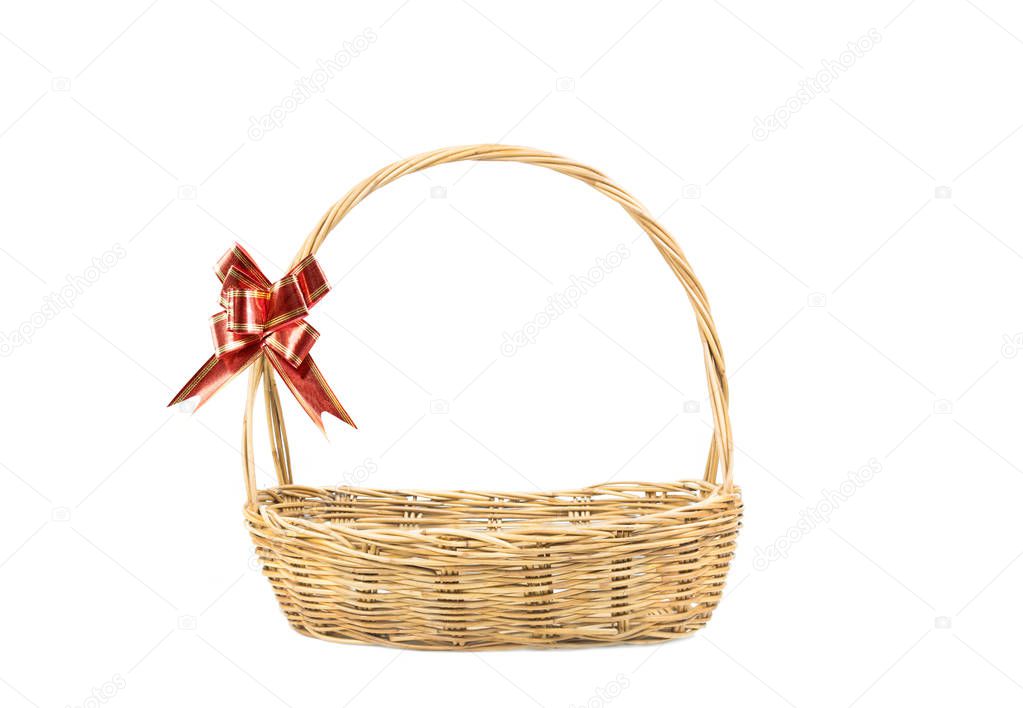 Empty wicker basket with red and gold ribbon isolated on white background