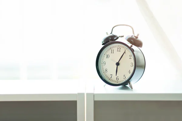 Alarm clock in the morning at bedroom.