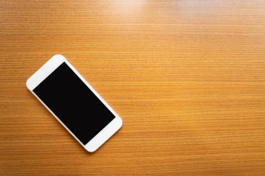 Ahşap masa akıllı telefon. Nesne için teknoloji kavramı