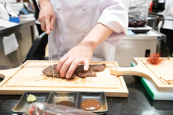 Abstract Chef is cooking Japanese style at the restaurant.