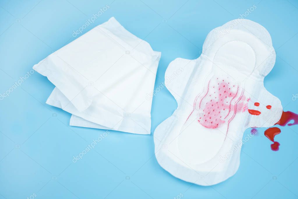 Sanitary napkins pad for women on color background.