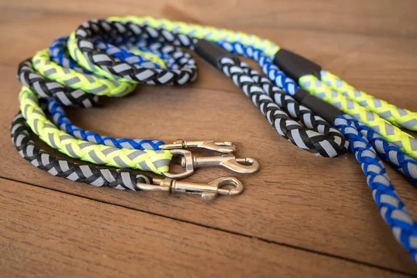 Pet leashes for dog or cat on wooden table. — Stock Photo, Image