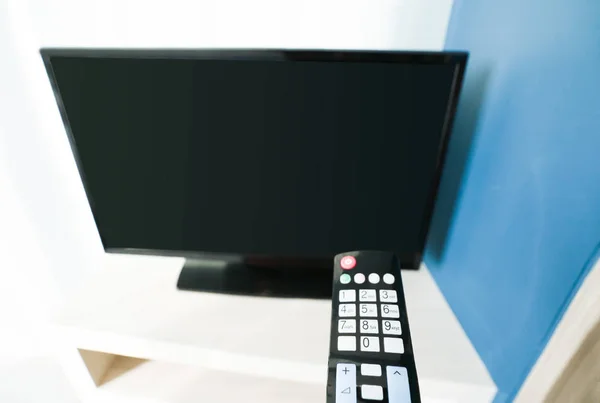 Remote control with television — Stock Photo, Image