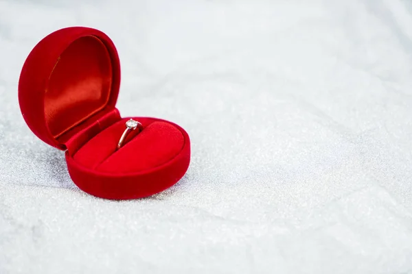 Red ring box with diamond ring for wedding day