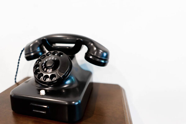 Black Vintage phone on wooden table