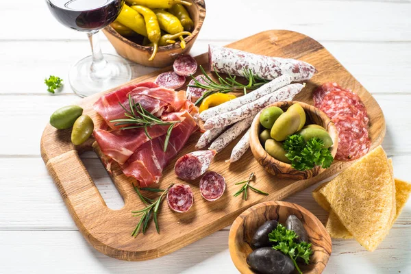 Antipasto delicatessen - meat, cheese and wine. — Stock Photo, Image