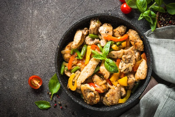 Chicken fried with vegetables.