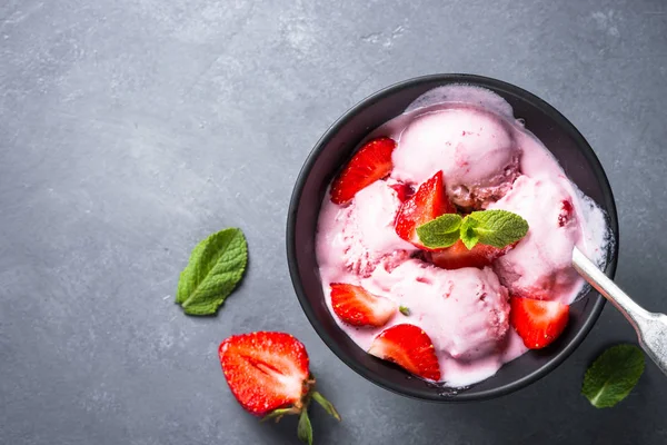 Strawberry ice cream on gray table. Top view. — Stock Photo, Image