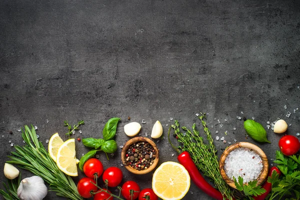 Selection of spices herbs and vegetables on black top view. — Stock Photo, Image