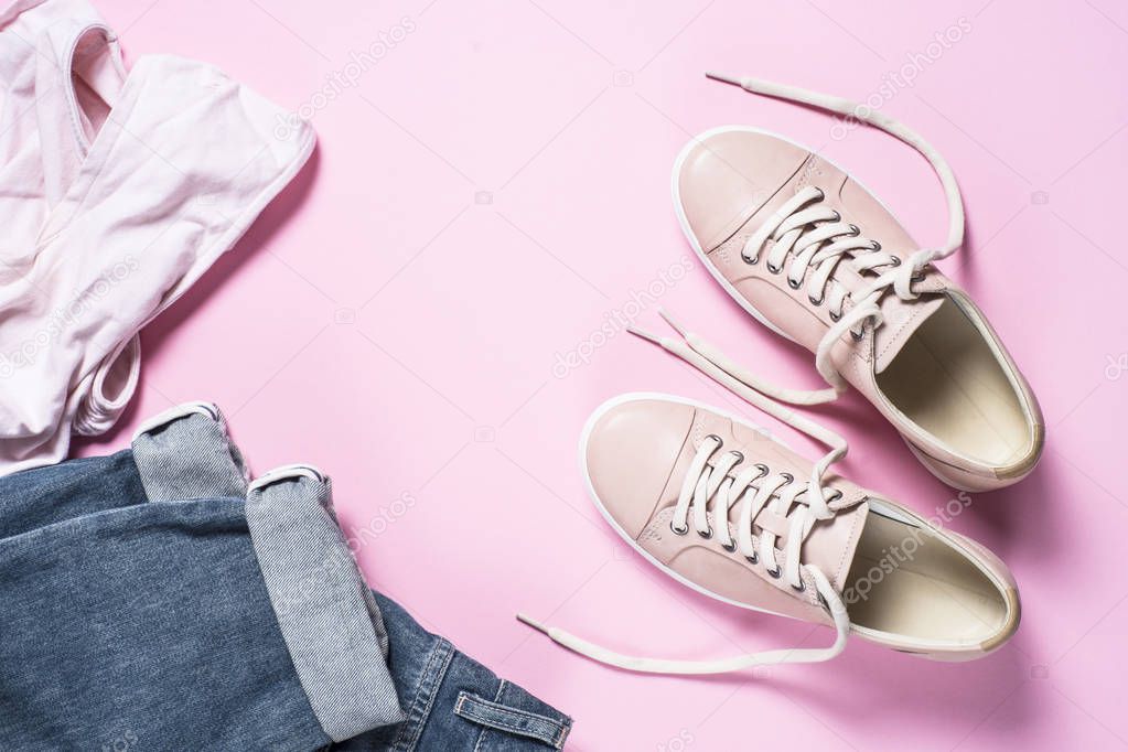 Woman fashion pink shoes on pink background.
