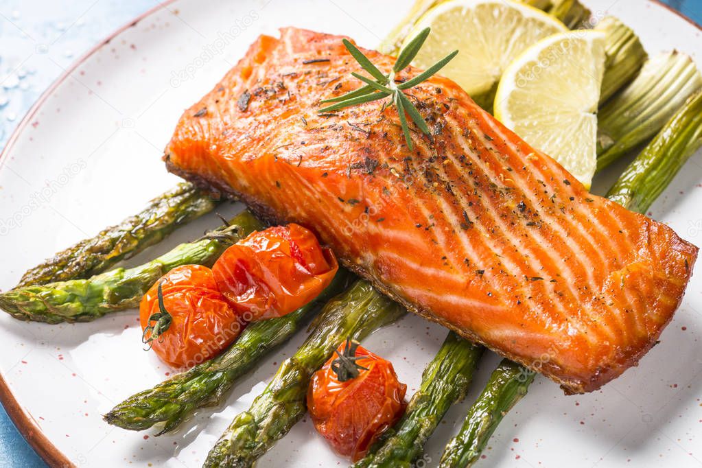 Grilled salmon fish fillet with asparagus. 