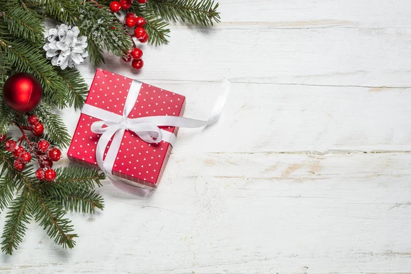 Christmas background with fir tree, present box and decorations — Stock Photo, Image