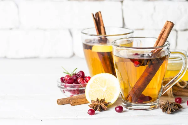 Autumn or winter hot tea with fruit, berries and spices. — Stock Photo, Image