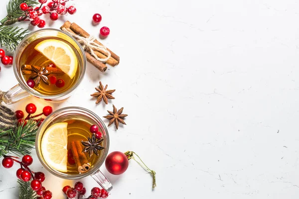 Winter hot tea with fruit, berries and spices on white table. — Stock Photo, Image