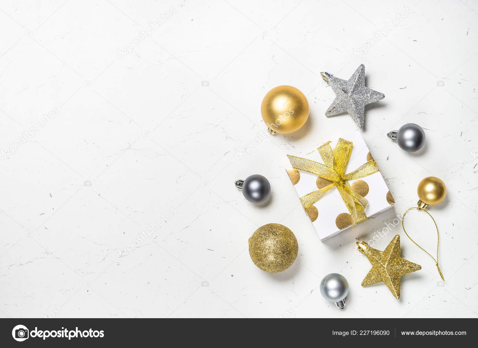 Christmas background with gold and silver decorations on black Stock Photo  by Nadianb