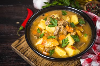 Goulash with meat and vegetables. Beef stew. clipart