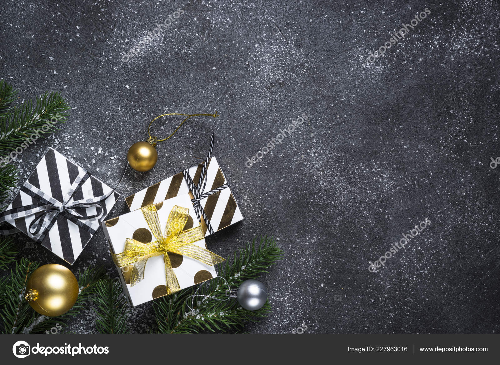 Christmas background with gold and silver decorations on black Stock Photo  by Nadianb