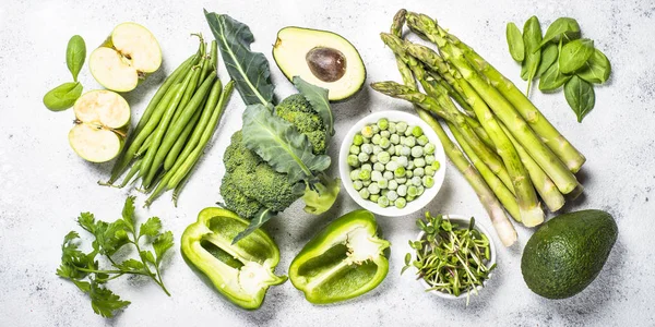 Green food assortment on light stone background. — Stock Photo, Image