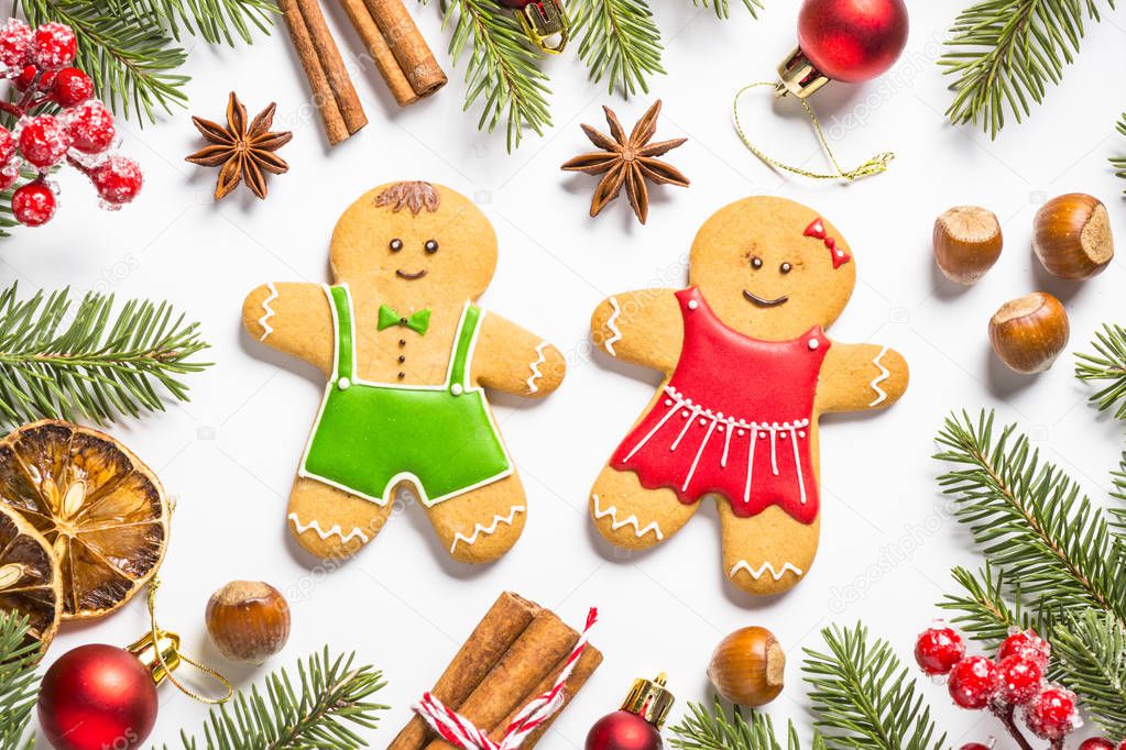  Christmas gingerbread cookies, spices and  decorations on white