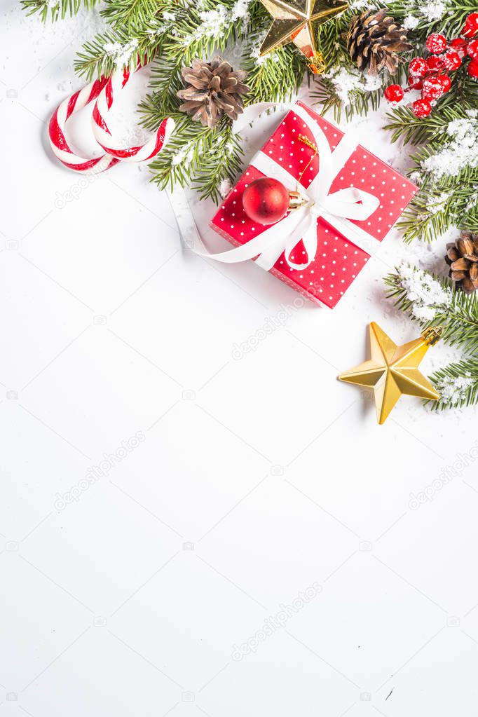 Christmas background with present and decorations on white.