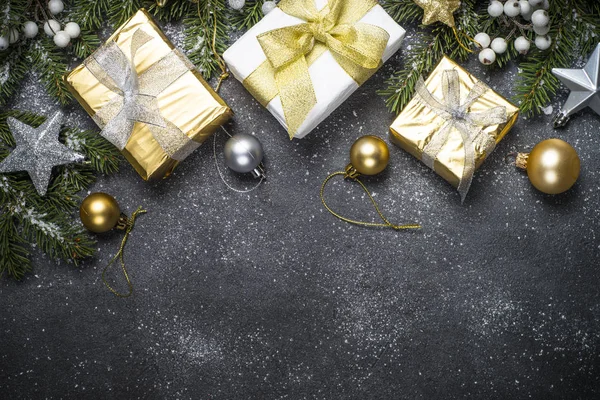 Christmas background - Gold and silver decorations and present b Stock  Photo by ©Nadianb 227963236