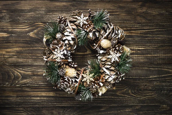 Christmas wreath on dark table top view. — Stock Photo, Image