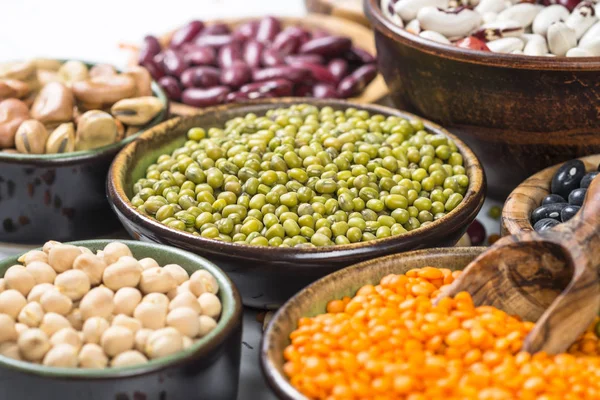 Legumes, lentils, chikpea and beans assortment on white. — Stock Photo, Image