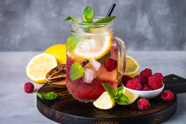 Raspberry lemonade in mason jar.