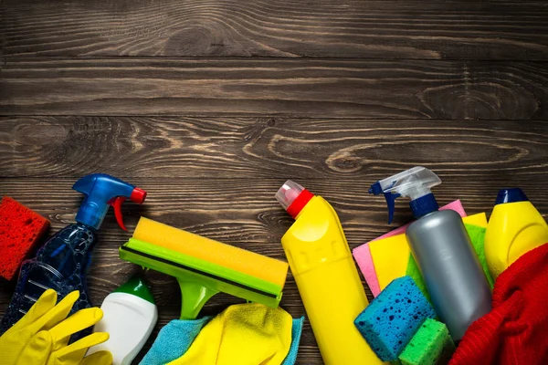 Cleaning product, household wooden table top view.