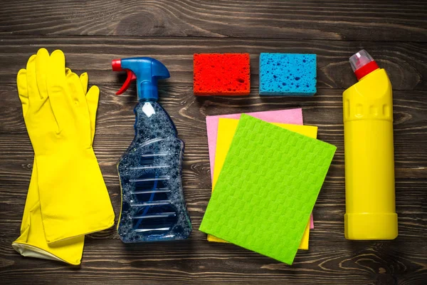 Cleaning product, household wooden table top view.