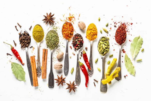 Set of various spices in spoons on white — Stock Photo, Image