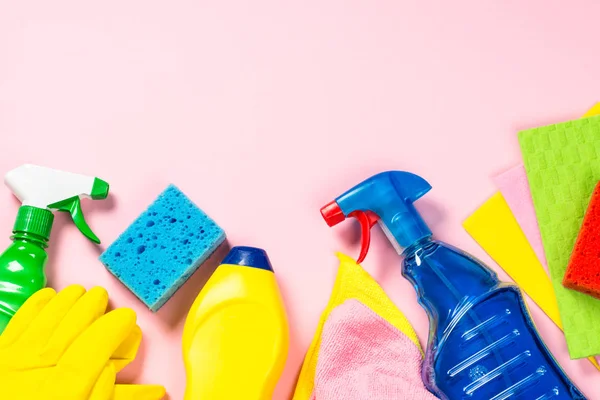 Cleaning product, household on pink top view.