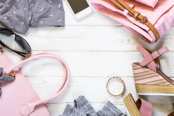 Woman clothes and accessories in pink and gray colors — Stock Photo, Image